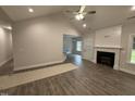 Bright living room featuring hardwood floors, fireplace and open layout, perfect for comfortable living at 1000 Peedin Rd, Selma, NC 27576