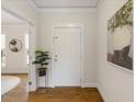Bright foyer with hardwood floors and elegant artwork at 1093 Trentini Ave, Wake Forest, NC 27587