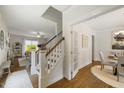 Open living space with hardwood floors, fireplace, and views to dining at 1093 Trentini Ave, Wake Forest, NC 27587