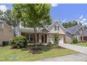Beautiful two-story home with landscaped yard and an attached garage at 126 Elmsford St, Durham, NC 27703