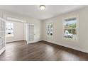 Bright office space with wood floors, natural light, and glass paneled doors at 134 Ivy Ridge Rd, Chapel Hill, NC 27516