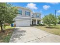 Two-story home with a two-car garage and a long driveway at 2 White Spruce Ct, Durham, NC 27703
