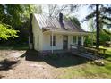 Exterior of home with a small porch, roof and yard with trees at 223 Gum Ave, Spring Hope, NC 27882
