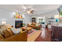 Bright living room with hardwood floors, fireplace, and stylish decor at 226 Marquis Dr, Cameron, NC 28326