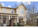 Inviting exterior view of a yellow townhome with a cozy covered porch area at 269 Sweet Bay Pl, Carrboro, NC 27510