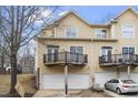 Rear exterior shot showing balcony decks and garages of a multi-unit townhome at 269 Sweet Bay Pl, Carrboro, NC 27510