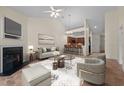 Comfortable living room with fireplace and views into the modern kitchen with bar stool seating at 4105 Gilchrist Dr, Burlington, NC 27215