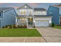 Beautiful two-story home with a well-manicured lawn and attached two-car garage at 4408 Walker Hallow St, Raleigh, NC 27616