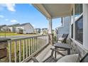 Relaxing front porch area with comfortable seating and neighborhood views at 4408 Walker Hallow St, Raleigh, NC 27616