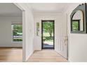 Inviting foyer with an open front door and views of the beautiful outdoors, showcasing natural light at 7 Dubarry Ct, Durham, NC 27705