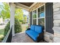 Cozy front porch features comfortable seating with a view of the neighborhood at 7101 Gibson Creek Pl, Cary, NC 27519