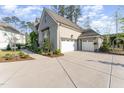 Side view of a spacious two-car garage with a large concrete driveway at 8208 Bella Oak Ct, Wake Forest, NC 27587