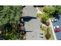 Aerial view of rooftops, manicured landscaping and sidewalks lined with shade trees at 918 Albany Ct, Raleigh, NC 27615