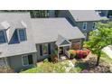 Attractive gray home highlighting its well-kept exterior, complete with an inviting entrance and lush landscaping at 918 Albany Ct, Raleigh, NC 27615