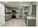 Modern kitchen features updated appliances, light countertops, and ample storage for cooking enthusiasts at 1010 Pool Rock Rd, Henderson, NC 27537