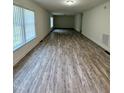 Open and spacious living room with bright windows, perfect for entertaining guests or relaxing at 1010 Pool Rock Rd, Henderson, NC 27537