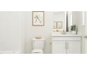 This bathroom features a stylish vanity with modern fixtures and ample natural light at 1645 Goldfinch Perch Ln, Knightdale, NC 27545