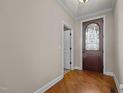 Inviting entryway with hardwood floors and an ornate front door at 2066 Lake Point Dr, Graham, NC 27253