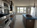 The kitchen features a spacious layout, modern appliances and finishes at 3022 White Rail Dr, Fuquay Varina, NC 27526