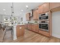 Modern kitchen featuring stainless steel appliances, granite countertops, and ample cabinetry at 3022 White Rail Dr, Fuquay Varina, NC 27526
