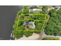 Aerial view of the waterfront property with mature trees and a private setting on the lake at 373 & 375 Sagamore Dr, Louisburg, NC 27549