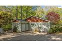Spacious two-car garage with matching doors, shingles, and exterior paint at 373 Sagamore Dr, Louisburg, NC 27549