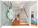 Welcoming entryway with hardwood floors, staircase, and view into adjacent rooms at 4 N Poston Ct, Durham, NC 27705