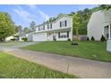 Traditional two-story home with lush green lawn, complemented by mature trees at 413 Weeping Willow Dr, Durham, NC 27704