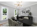 Elegant dining room featuring modern chandelier and decor, perfect for Gathering gatherings at 5301 Night Heron Dr, Wake Forest, NC 27587