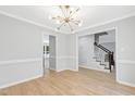 Open-concept living space with views of the staircase, creating a seamless flow at 5301 Night Heron Dr, Wake Forest, NC 27587