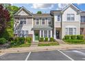 Charming townhome with a well-manicured lawn and inviting curb appeal at 5318 Crescentview Pkwy, Raleigh, NC 27606