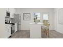 Bright kitchen features an island with seating, stainless steel appliances, and white cabinets at 613 Cassa Clubhouse Way, Knightdale, NC 27545