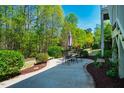 Outdoor patio area with seating, perfect for entertaining and enjoying the serene backyard at 658 Bennett Mountain Trce, Chapel Hill, NC 27516