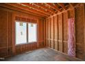 Framed bedroom with large window and insulation, under construction at 7961 Wexford Waters Ln, Wake Forest, NC 27587