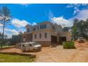 Side view of a new construction two-story home on a sunny day at 7961 Wexford Waters Ln, Wake Forest, NC 27587