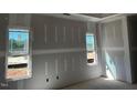 Bedroom featuring newly installed drywall and dual windows offering views and natural light at 871 Olive Branch Dr, Smithfield, NC 27577
