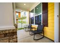Close up of the front porch seating with a view of the neighborhood at 91 Cliffdale Rd, Chapel Hill, NC 27516