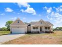 Beautiful single-Gathering home with front porch, two-car garage, and inviting curb appeal at 9391 Turkey Way, Middlesex, NC 27557