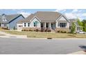 Beautiful single-Gathering home featuring manicured landscaping and a cozy front porch area at 101 Becklow Ridge Lane Ln, Holly Springs, NC 27540