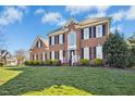 Attractive brick residence boasts manicured landscaping and a well-maintained lawn on a sunny day at 101 Silk Leaf, Cary, NC 27518