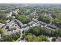 Expansive aerial view of a residential community nestled among lush green trees and winding streets at 1029 Frank Page Dr, Cary, NC 27519