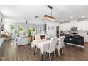 Open concept living space with modern decor, a dining area, and a spacious kitchen at 1036 S Fieldhaven Dr, Fuquay Varina, NC 27526