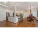 Spacious kitchen with hardwood floors, a central island, and stainless steel appliances at 108 Monarch Way, Cary, NC 27518