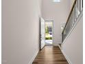 Welcoming foyer with hardwood floors, a staircase, and plenty of natural light at 1120 Copper Beech Ln, Wake Forest, NC 27587