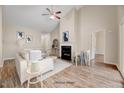 Inviting living room featuring a cozy fireplace, vaulted ceilings, and hardwood floors at 1123 Claret Ln, Morrisville, NC 27560