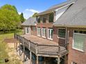 Spacious wooden deck with black railing, perfect for outdoor entertaining and relaxation at 1174 Robertson Rd, Roxboro, NC 27574