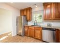 Well-equipped kitchen with stainless steel appliances, granite countertops, and ample storage at 127 Long Shadow Pl, Durham, NC 27713