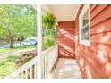 Inviting covered porch with white railing, perfect for enjoying the outdoors and relaxing at 127 Long Shadow Pl, Durham, NC 27713