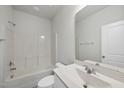Clean, bright bathroom features a shower-tub combo and modern vanity at 1335 Herb Garden Way, Apex, NC 27502