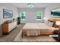 Cozy main bedroom with carpet, bright windows, and modern decor at 136 W Tecoma Ln, Clayton, NC 27520